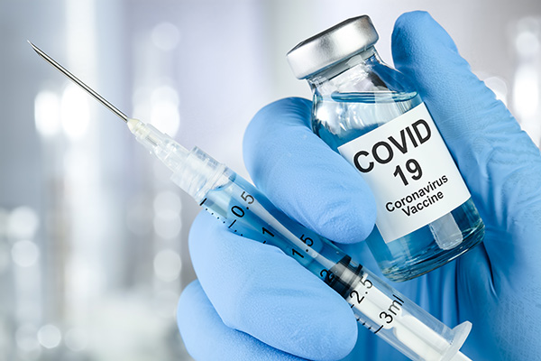 COVID vaccine vial and syringe