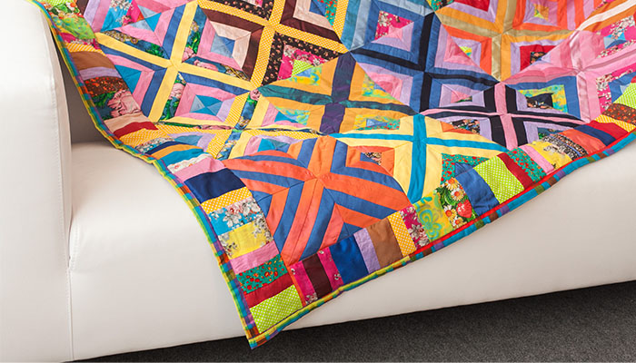 Patchwork quilt lying on a sofa