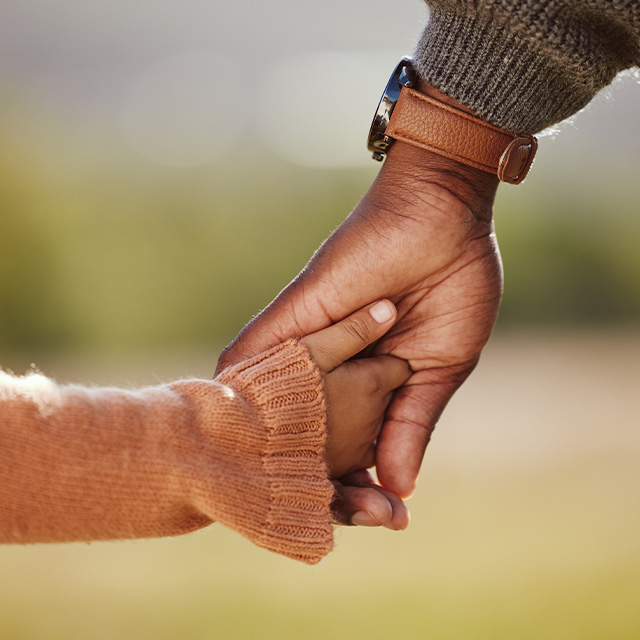 Parent and child holding hands