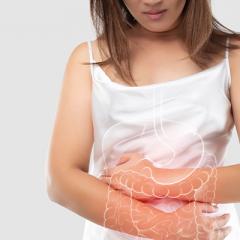 Woman in pain holding abdomen