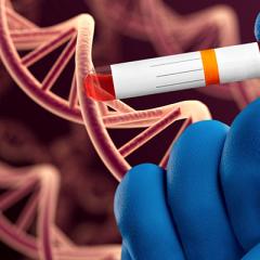 DNA and gloved hand with blood sample