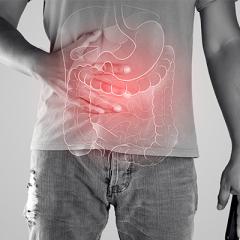 man showing illustration of intestines on top of clothes 