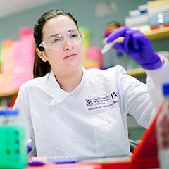 Dr Rebecca Coll in the lab