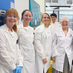 Pauline North visiting lab of researchers