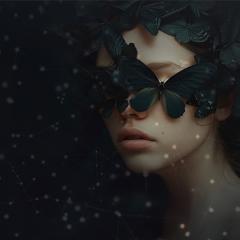 An image of a women with butterflies covering her eyes