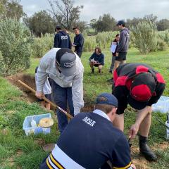 Students from the Muresk Institute in Western Australia collect soil samples