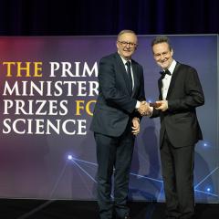 Prime Minister Anthony Albanese presenting Professor Glenn King with the Prime Minister's Prize for Innovation