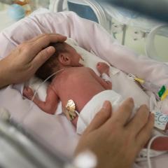 A baby with neonatal meningitis being cared for at a hospital