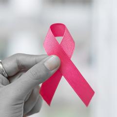 Breast Cancer Awareness - hand holding pink ribbon