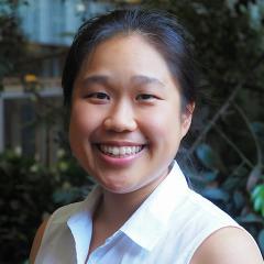 PhD student Chloe Yap smiling with a white collared shirt