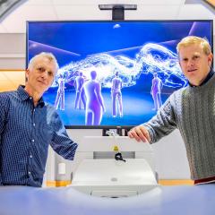 Robert Parton and Kristofer Thurecht in front of VR image