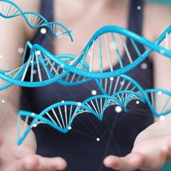 Woman holding helices of DNA